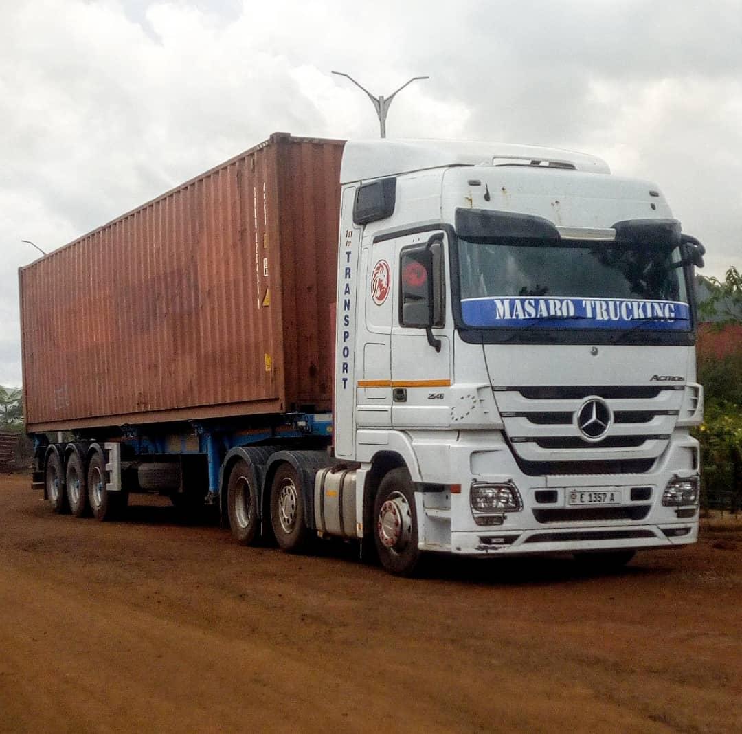 MASABO TRUCKING Mercedes-Benz Actros semi-trailer hauling a shipping container — cross-border freight East Africa